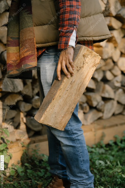 Black man getting firewood for fire-pit