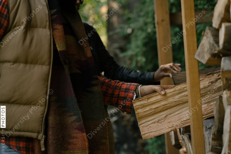 Black man getting firewood for fire-pit