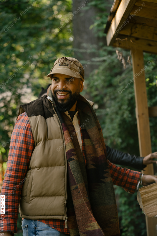 Black man getting firewood for fire-pit