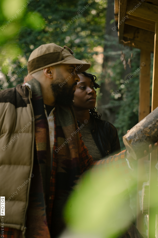 Black man and spouse getting firewood for fire-pit