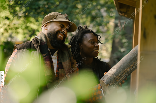 Black man and spouse getting firewood for fire-pit