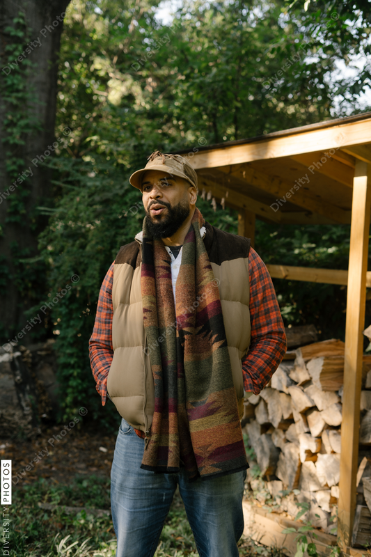 Black man getting firewood for fire-pit