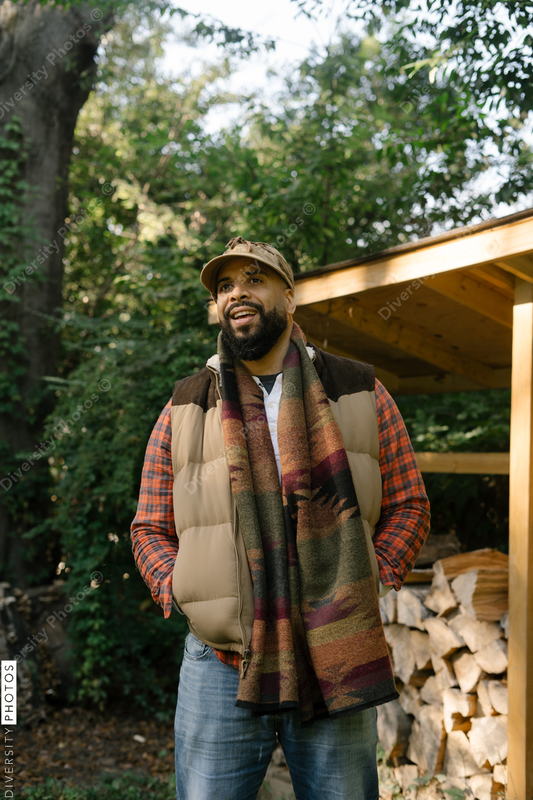 Black man getting firewood for fire-pit