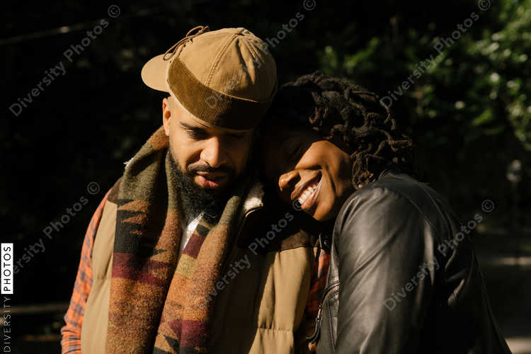 African American couple walking in neighborhood