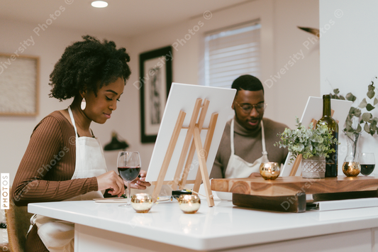 Black couple having at home date night, painting romantic DIY