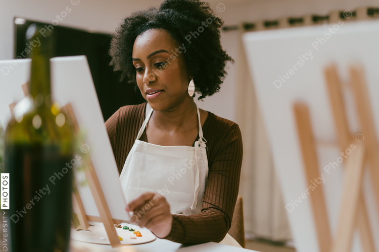 Couple having DIY date night at home, painting