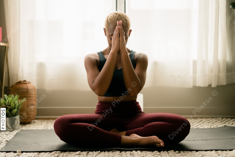 Black woman meditating at home