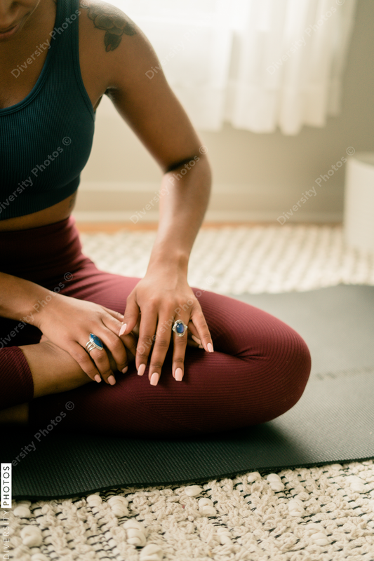 Young woman practices yoga at home