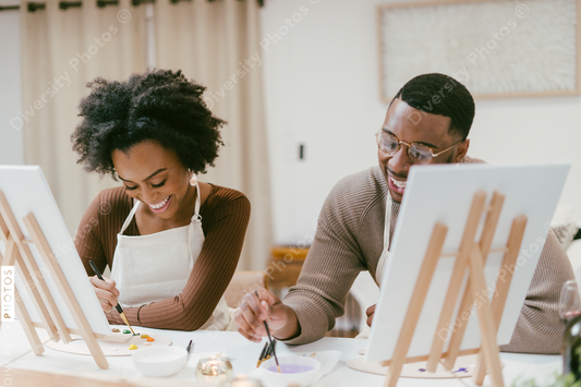 Black couple has fun painting and laughing during date night, paint and craft DIY