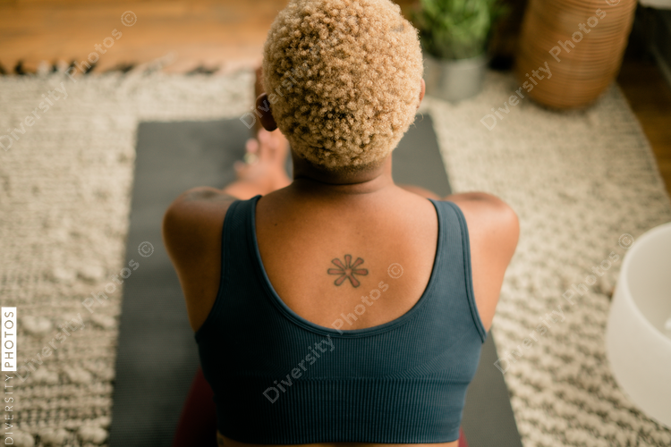 Young woman practices yoga at home