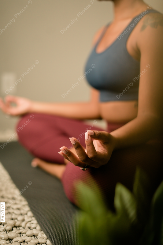 Young woman practices yoga at home