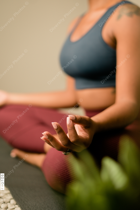 Young woman practices yoga at home