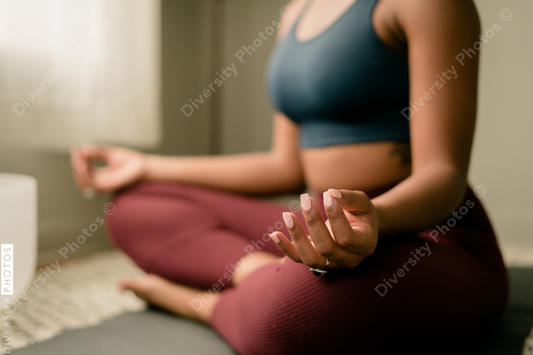 Young woman practices yoga at home