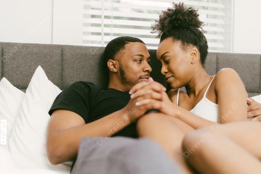Young Black couple embracing at home, connected love
