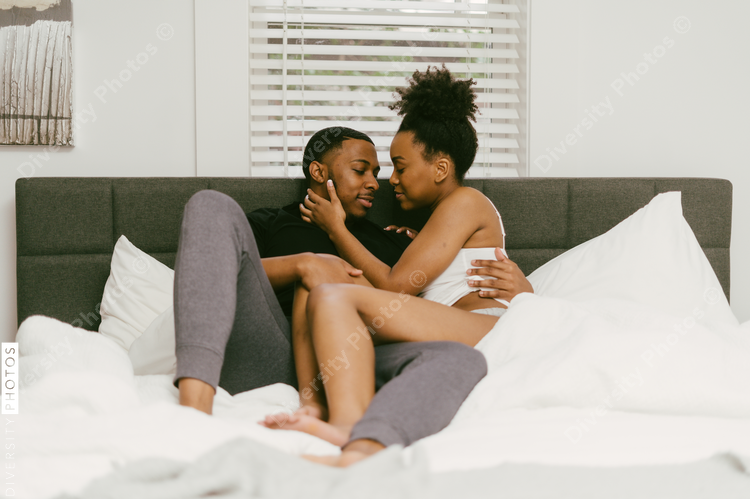 Young Black couple embracing at home, connected love