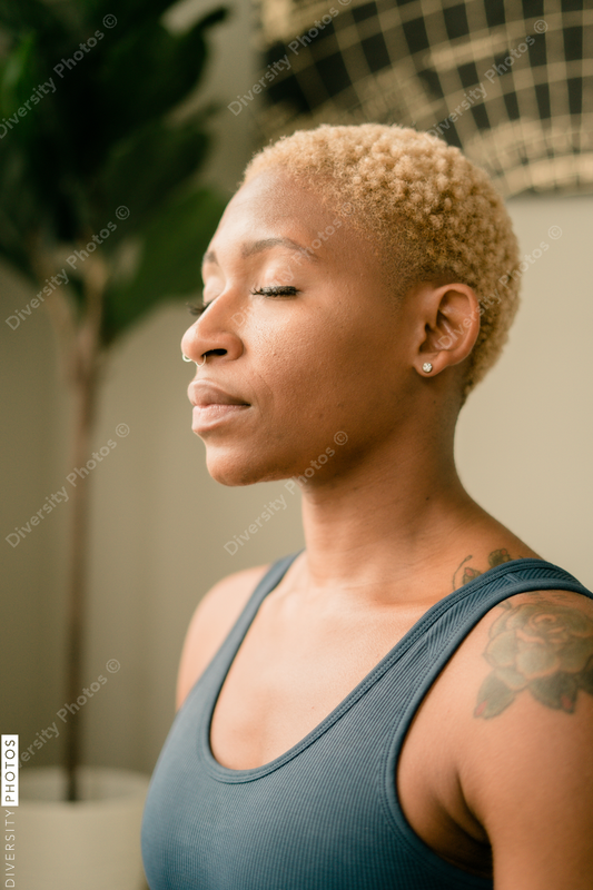 Young woman practices yoga at home