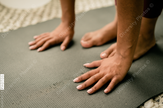 Young woman practices yoga at home