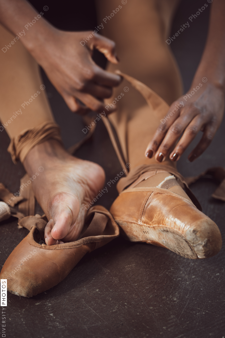 Black ballerina dancer takes off pointe shoes, pushing through pain, perseverance 