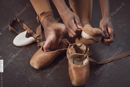 Black ballerina dancer takes off pointe shoes, pushing through pain, perseverance 