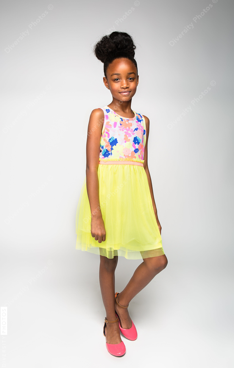 Portrait of girl standing against white background