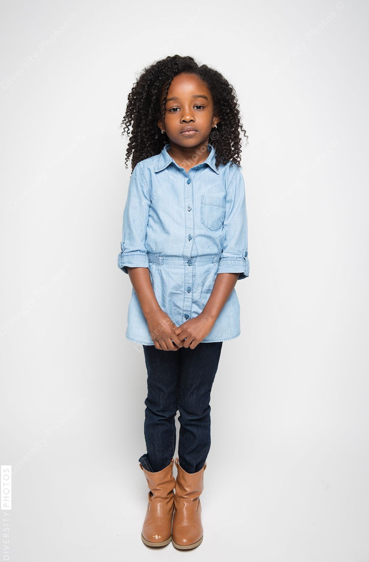 Girl standing against white background