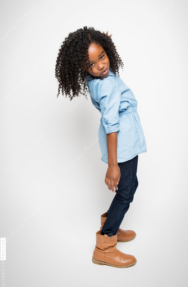 Girl standing against white background
