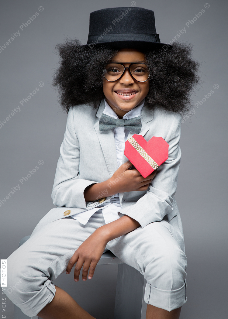 Portrait of girl in suit with Valentines day heart