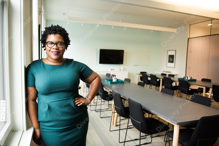 Portrait of smiling businesswoman standing in office
