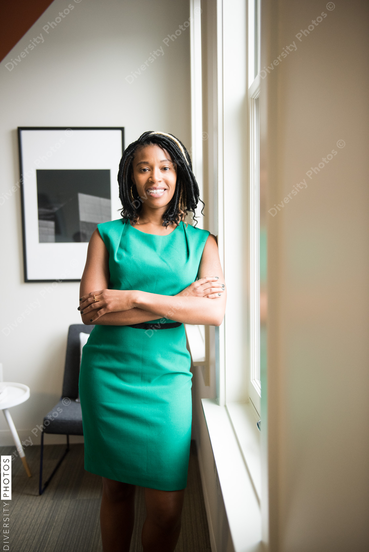 Portrait of smiling businesswoman standing in office