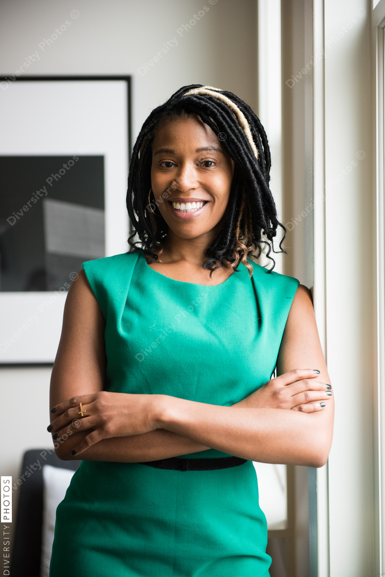Portrait of smiling businesswoman standing in office