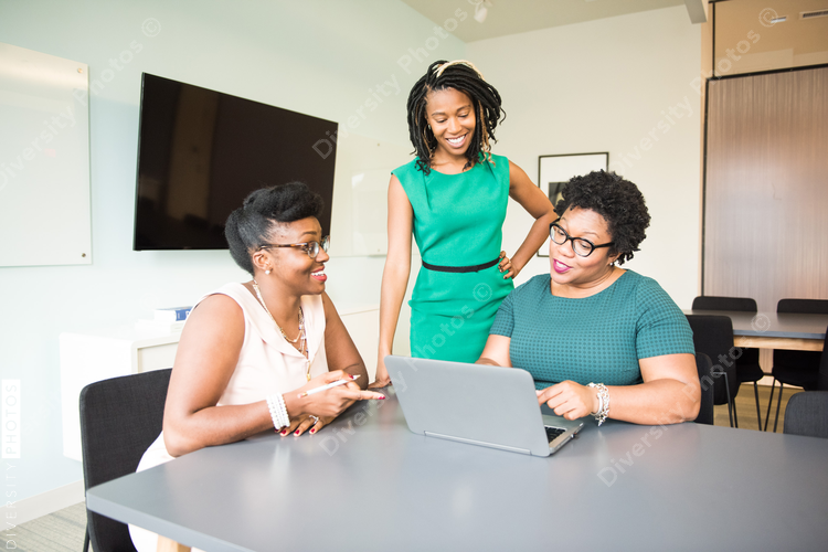 Businesswomen discussing on laptop in the office 