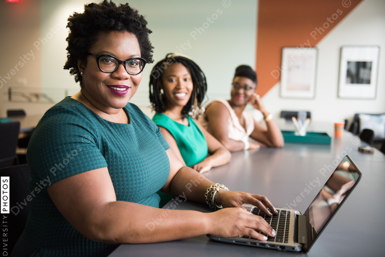 Portrait of smiling businesswomen sitting in the office