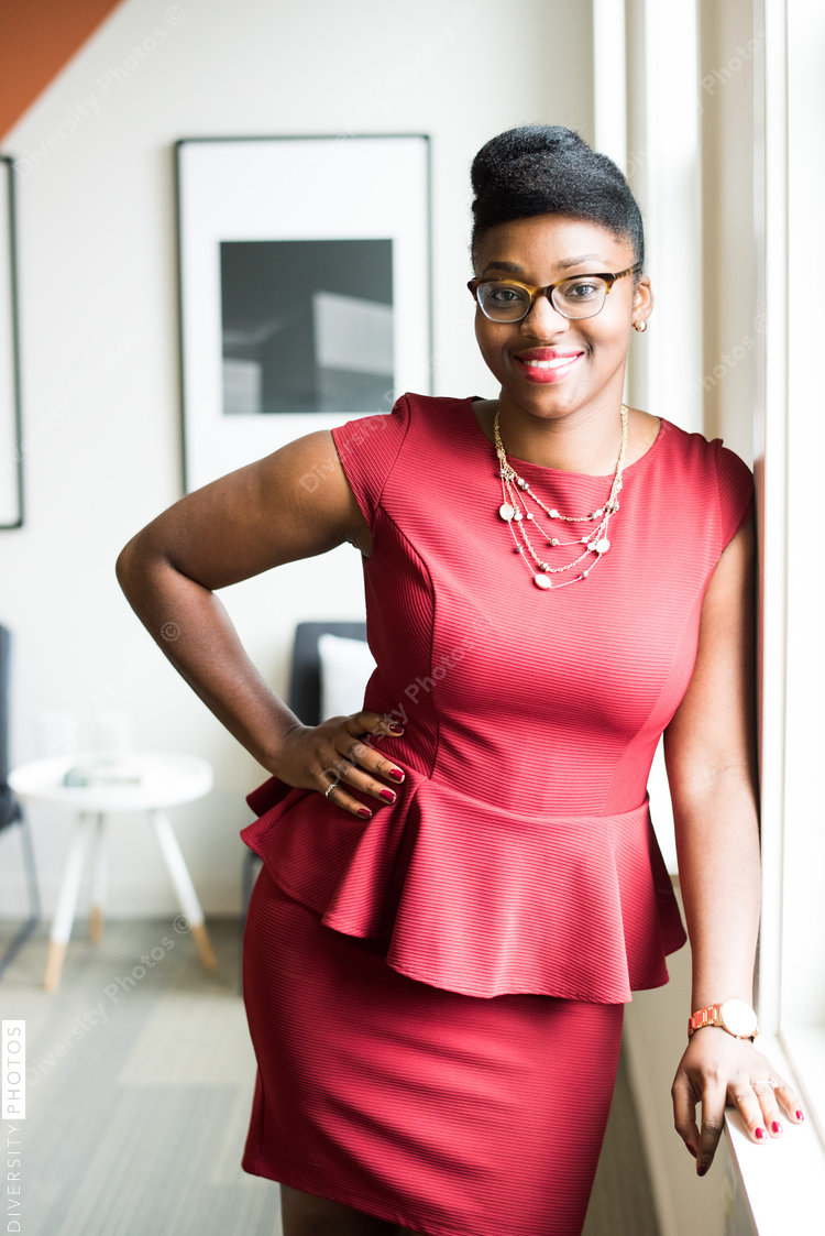 Portrait of smiling businesswoman standing in office