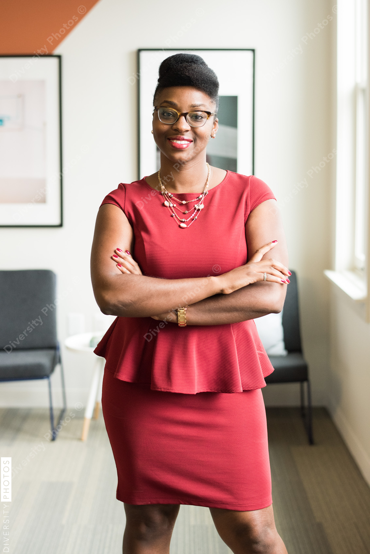 Portrait of smiling businesswoman standing in office
