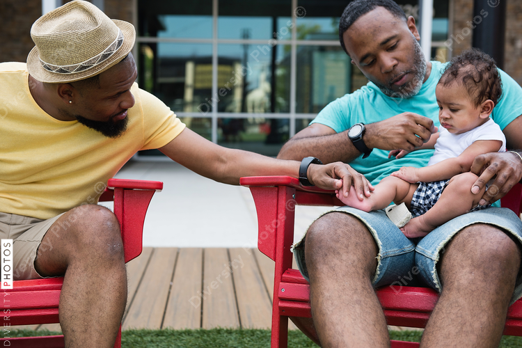 Couple cuddling their baby