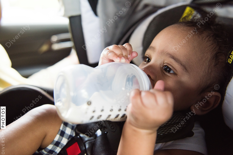 Close up view of baby drinking milk