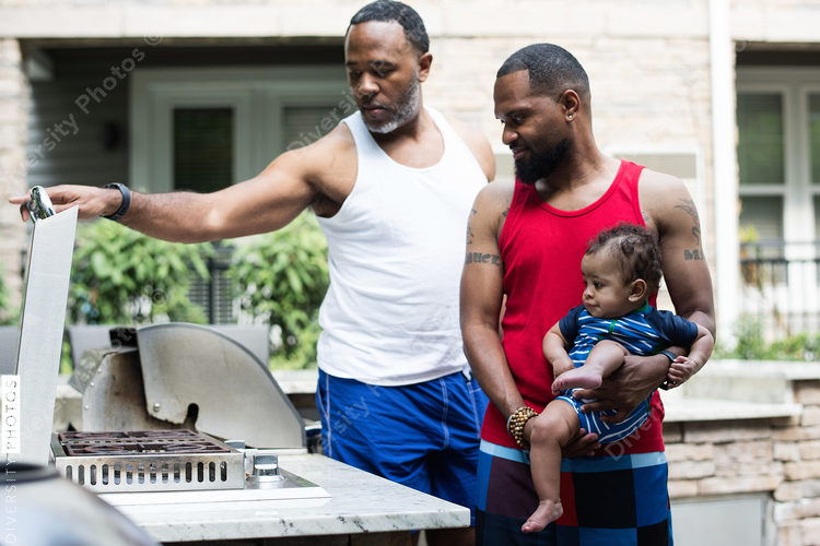 Man setting grill at backyard