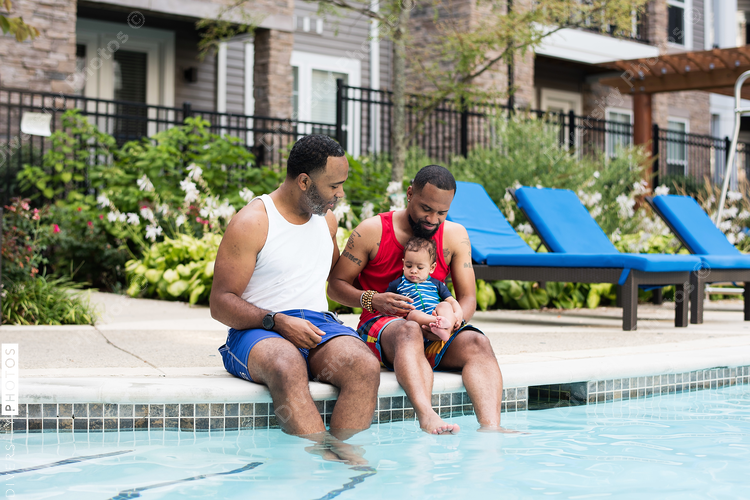 Family spending time at swimming pool