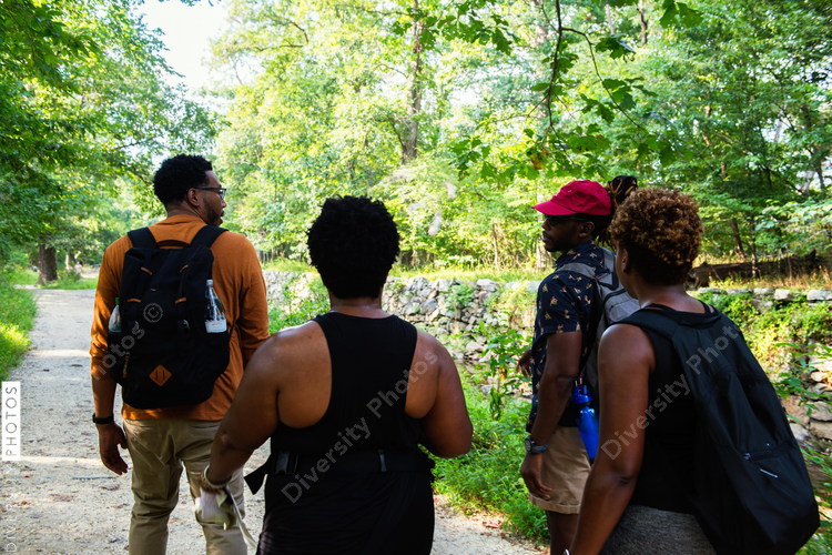 Diverse friends hiking mountain walking trail