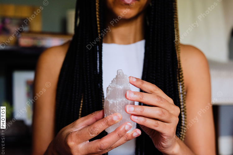 Woman holding healing crystals