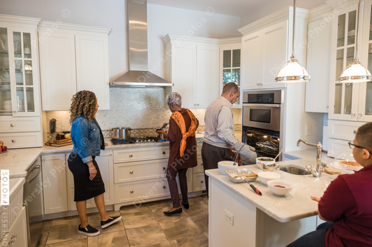 Black mother and daughter cooking in the kitchen