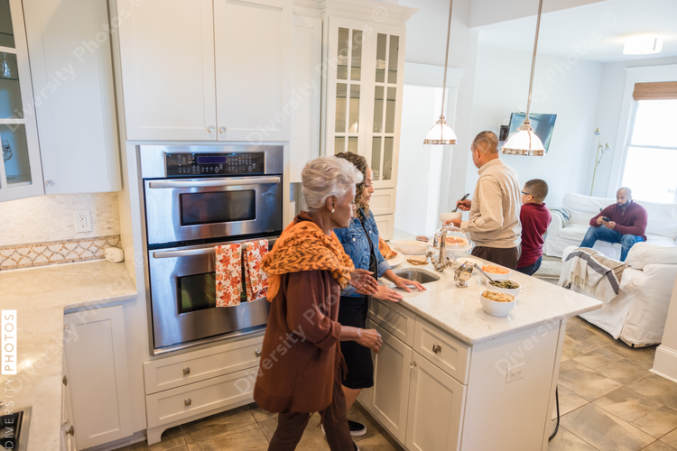 Family prepares Thanksgiving food in kitchen