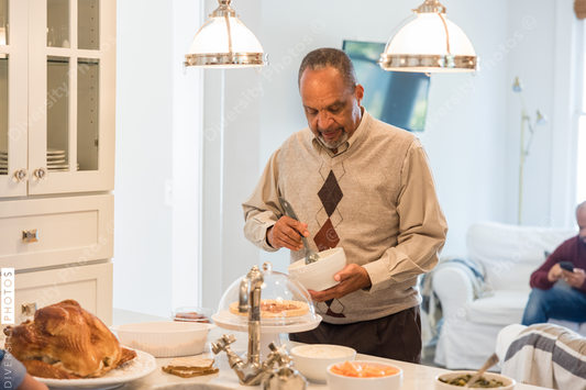 Black grandfather helps prepare Thanksgiving meal