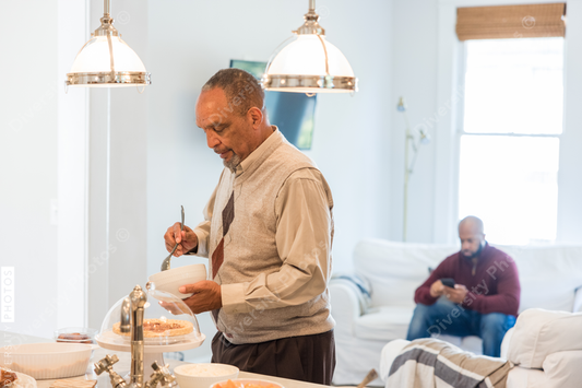 Black grandfather helps prepare Thanksgiving meal