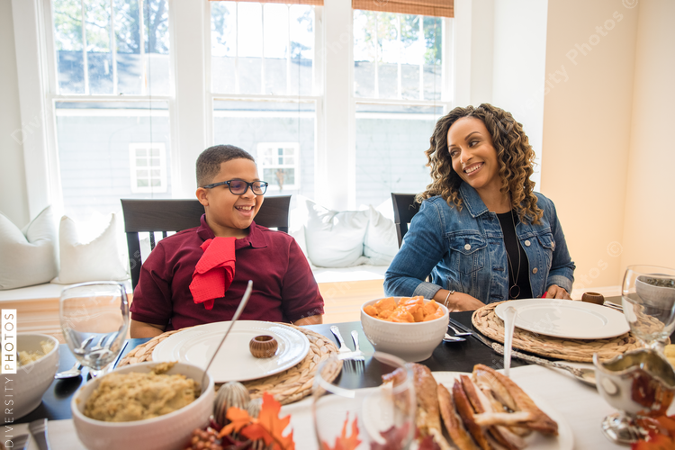 Black multigenerational family eating Thanksgiving holiday meal