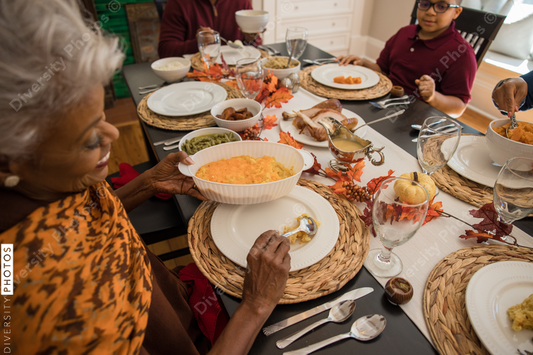 Black multigenerational family eating Thanksgiving holiday meal