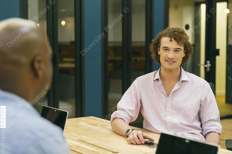 Businessmen talking in office