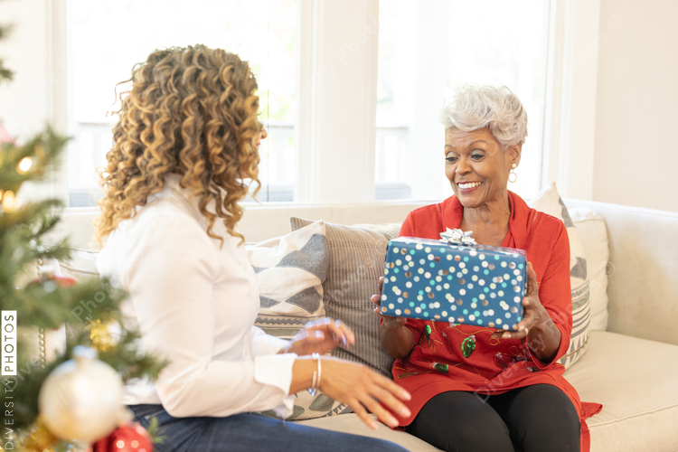 Mother and daughter sharing gifts on Christmas