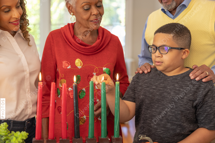 Multigenerational black family celebrating Kwanzaa together