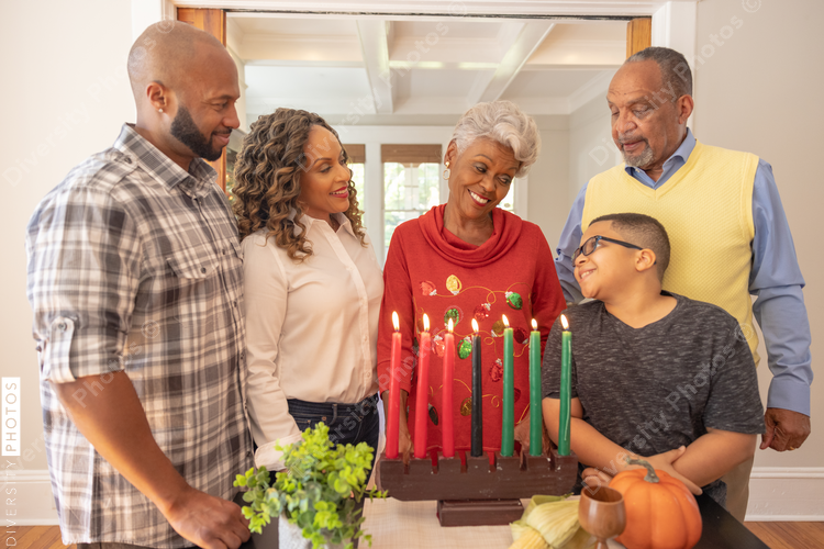 Multigenerational black family celebrating Kwanzaa together